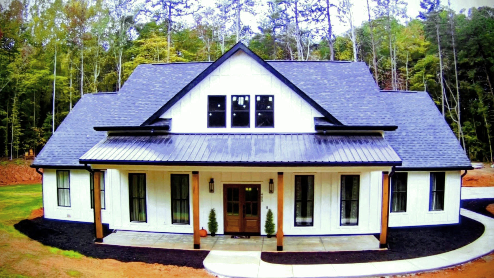 Modern Farmhouse Plan 041-00216 — full front exterior view with board and batten siding and covered porch