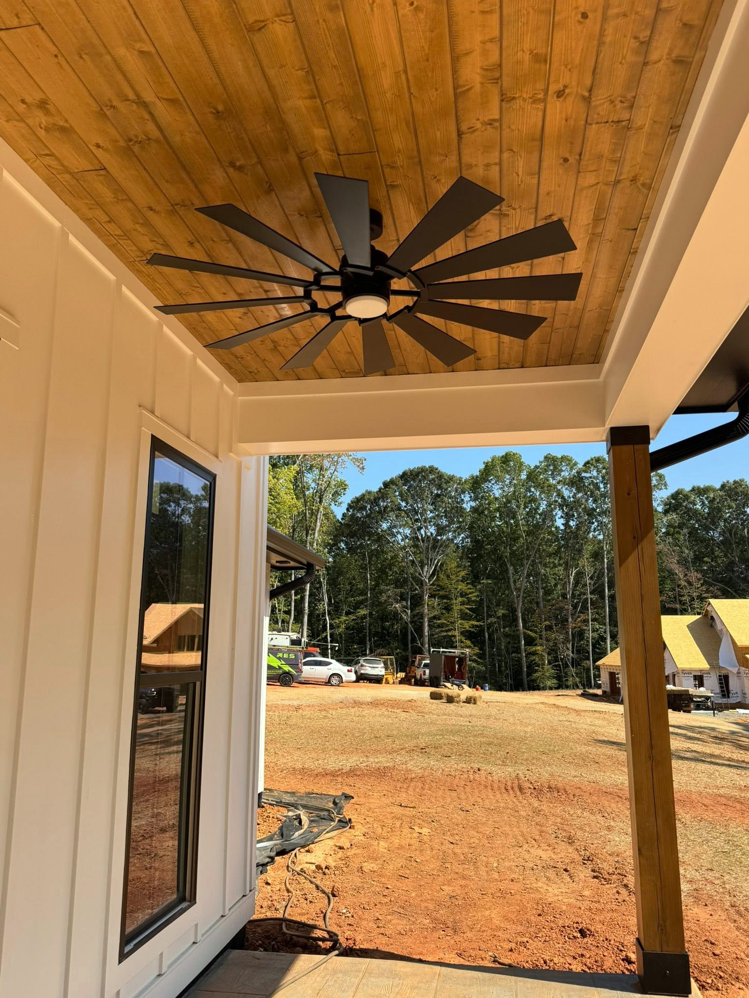 Plan 041-00216 covered front porch with timber columns — built by Square Built Construction Services